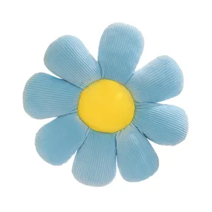Blue flower-shaped daisy throw pillow with yellow center and ribbed corduroy texture
