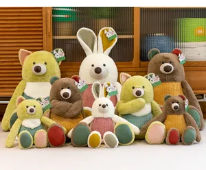 Collection of assorted plush jungle animal dolls in various sizes and earthy colors