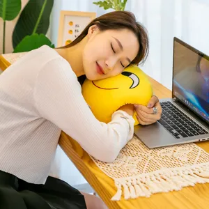 Yellow smiley face nap pillow with arm-hole design for office desk napping