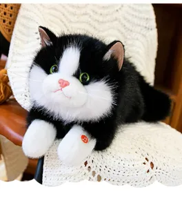 Close-up of realistic black and white cat plush toy with soft fur and sound feature