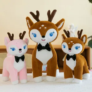 Tre simpatici peluche a forma di cervo in marrone e rosa con papillon per bambini