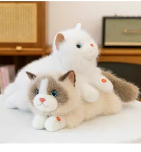 Macro view of realistic white and ragdoll plush cats with sound buttons.