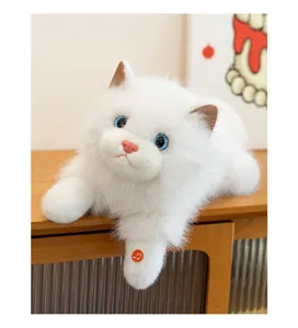 Detailed view of realistic white plush cat with musical sound button on paw