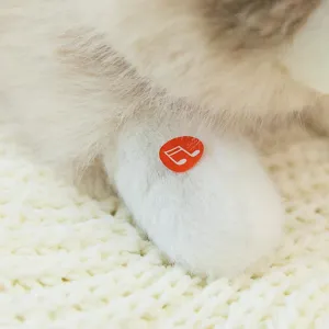 Soft realistic ragdoll cat plush toy featuring a sound button detail on the paw