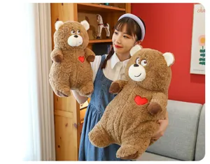 Cute brown plush teddy bear hug pillow with red love heart, soft stuffed doll gift for girls.