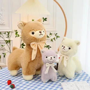 Set of three cute cream and pastel alpaca plush toys with decorative bows for home decor