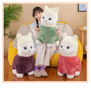 Cute alpaca plush toys in green, purple, and pink held by a girl in home setting