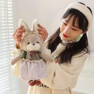 Adorable plush bunny toy in a dress held by a model, soft stuffed animal gift
