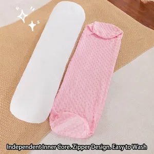 Long cylindrical minky dot body pillow with removable pink cover and white inner core