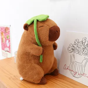 Cute brown capybara plush toy with green lotus leaf hat decorative soft soothing cushion