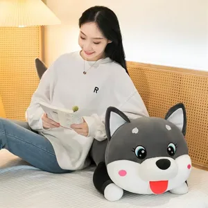 Detail view of a large husky plush body pillow being used as a cozy bed backrest