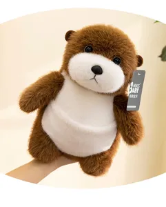 Close-up detail of a soft brown and white plush sea otter toy with a hanging brand tag