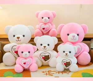Group of pink and white plush teddy bears holding hearts for Valentine's Day gifts.