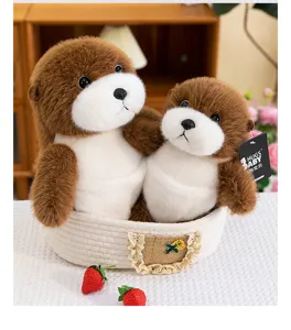 Detailed view of two cute simulation sea otter plush toys in a woven basket