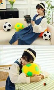 Macro view of a soft plush soccer ball pillow in vibrant yellow and green colors