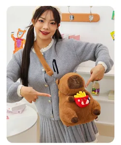 Detailed view of the soft brown capybara plush backpack worn by a model in a cute setting