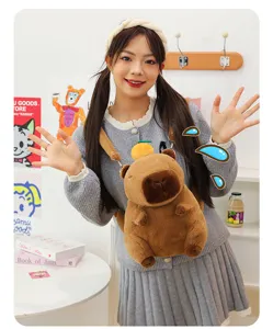 Close-up of cute capybara plush backpack worn by model in cozy room setting