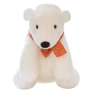 Cute white polar bear plush toy wearing an orange scarf, sitting pose for holiday gifts