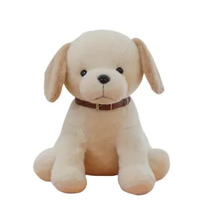 Adorable Labrador plush toy puppy with brown buckle collar on white background
