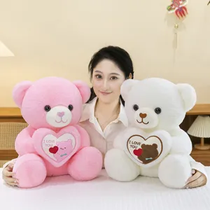 Soft pink and white teddy bears holding hearts, perfect for Valentine's Day gifts.