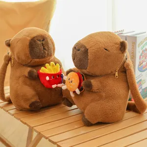 Cute brown Capybara plush backpacks holding burger and fries on a wooden table