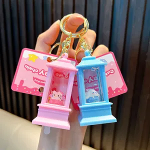 Detail view of pink and blue oil-filled quicksand keychains with cute cartoon characters