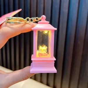 Macro detail of pink lantern keychain featuring liquid quicksand and a cute character doll inside