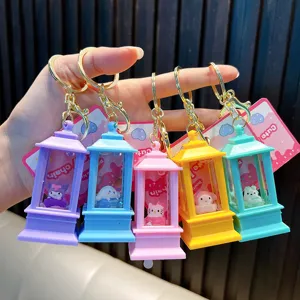 Close-up of five colorful oil-filled liquid keychains featuring cute cartoon characters