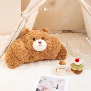 Adorable peluche de almohada de croissant con forma de oso en suave vellón marrón