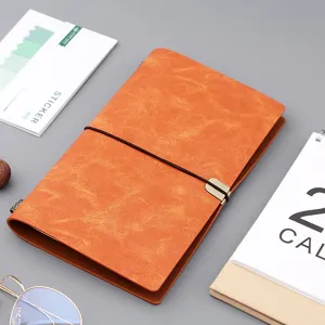 Vintage A6 Notizbuch aus orangefarbenem Kunstleder mit elastischem Verschlussband