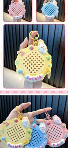 Detailed view of colorful rabbit-themed magnetic drawing board keychains in pink, blue, and yellow
