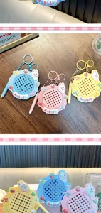 Detailed view of colorful rabbit magnetic drawing board keychains in pink, blue, and yellow