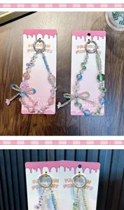 Close-up of cute beaded flower phone charms with colorful bow-knots