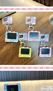 Macro detail of colorful pig-themed mini sketchpad keychains for backpack charms.