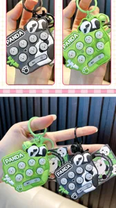 Detail of panda electronic whack-a-mole game keychain for stress relief