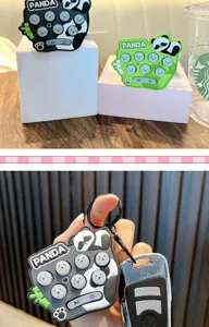 Close-up of cute panda electronic whack-a-mole game keychain with soft silicone buttons