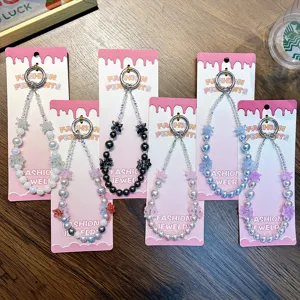 Handmade beaded flower phone charms and wrist straps in various colorful designs