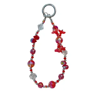 Red crystal beaded phone chain and bag charm with 3d floral design and metal ring pendant.