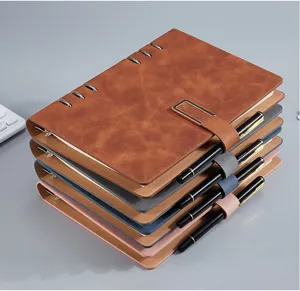 Stack of four professional A5 6-ring binders with metal buckle closure and black pens.