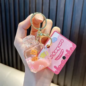 Adorable oil-filled tiger perfume bottle keychain with pink quicksand liquid and gold ring