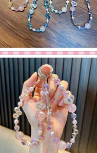 Detailed close-up view of colorful heart crystal beaded keychains being held in hand