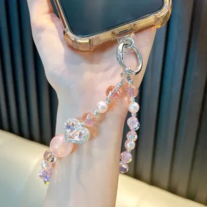 Heart-shaped crystal beaded phone strap with pink pearls and silver clasp connector