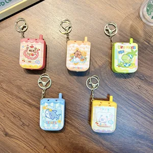 Set of five colorful mini phone keychains with electric maze games and cartoon animals