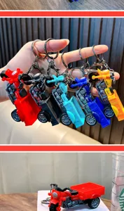 Set of five colorful miniature motor tricycle toy keychains in red, blue, black, yellow