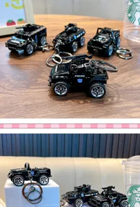 Close-up of various black pull-back police car model keychains on a wooden surface