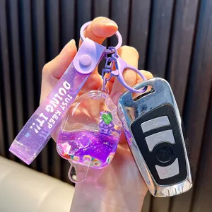 Purple liquid quicksand popsicle keychain with fruit charm and purple wrist strap