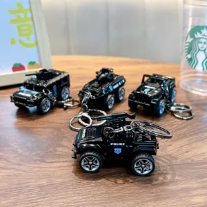 Police car keychain set featuring miniature armored vehicle and SUV models