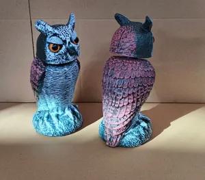 Front and back view details of realistic owl decoys designed to scare away birds
