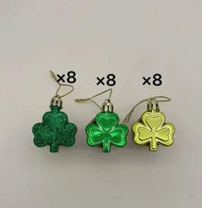 Set of 24 St. Patrick's Day shamrock hanging ornaments in three green shades.