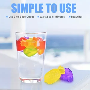 Reusable colorful fruit-shaped plastic ice cubes for drinks shown in a clear glass